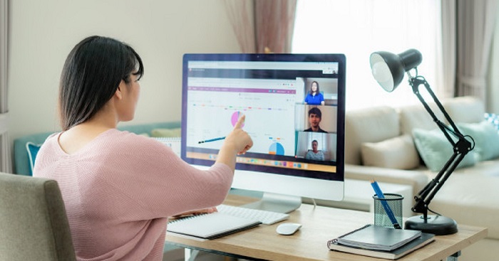 A Business Woman Working With Her Laptop In A Team Meeting.